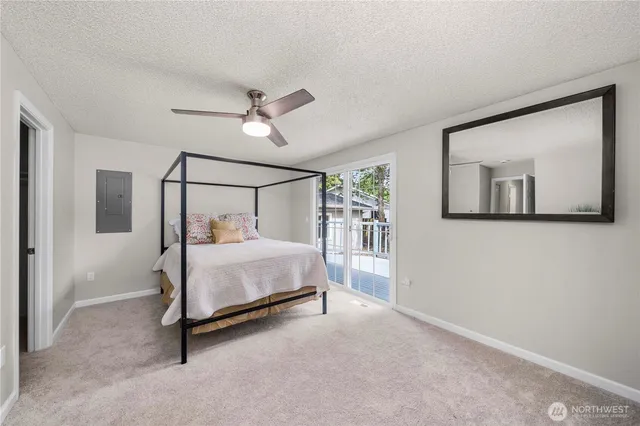 a bed room with a bed and a chandelier