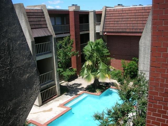 a view of backyard of house with seating space