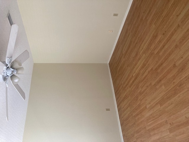 3115 Helms Street, Unit 302 Austin, TX 78705 - Photo 3 of 9 a view of an empty room with a fan