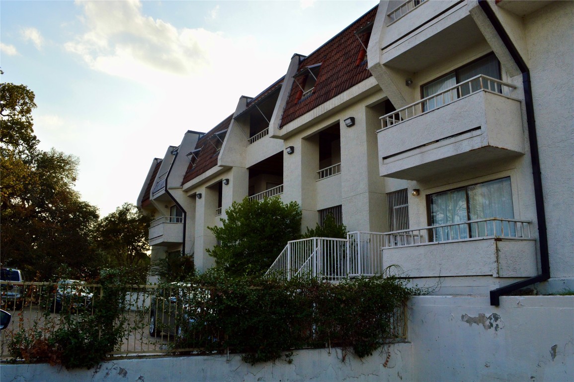 3115 Helms Street, Unit 302 Austin, TX 78705 - Photo 9 of 9 a front view of a house with plants