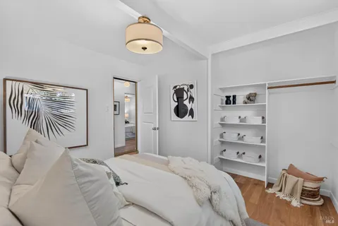 a bedroom with a bed and dresser