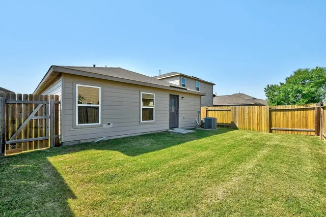 a view of a house with yard and a garden