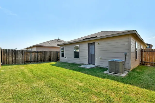 a view of a backyard of the house