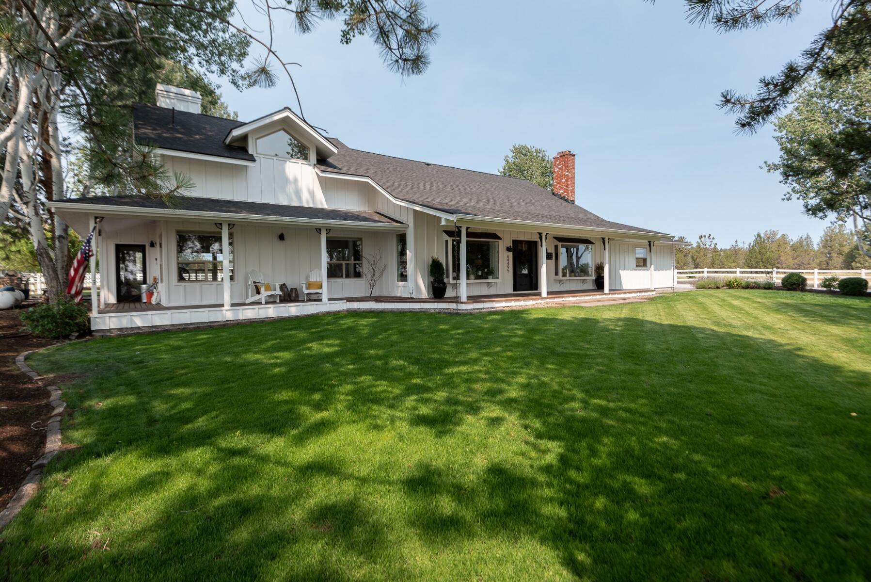 64495 Research Road Bend, OR 97703 - Photo 6 of 54 a front view of a house with a yard table and chairs