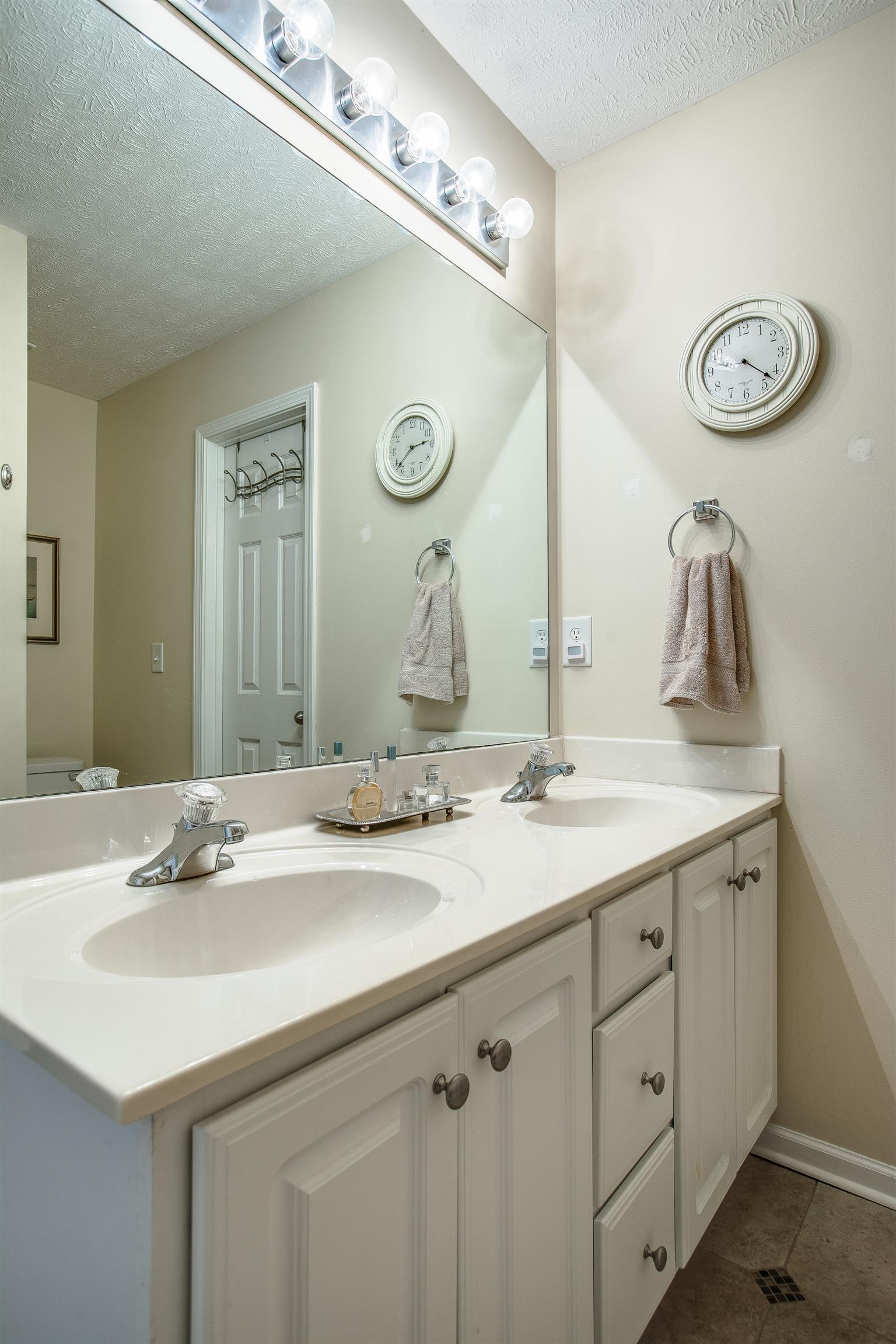 2008 Fiona Way Spring Hill, TN 37174 - Photo 12 of 20 Master bath features all white cabinetry and a double sink vanity and tile flooring.