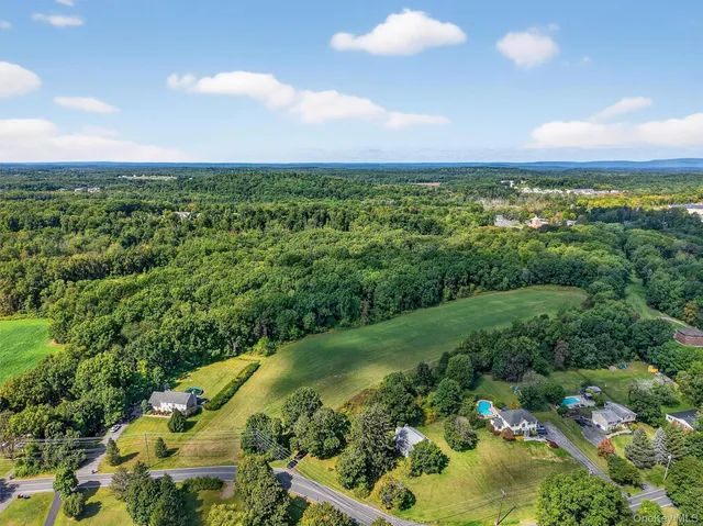 a view of a city with mountains in the background