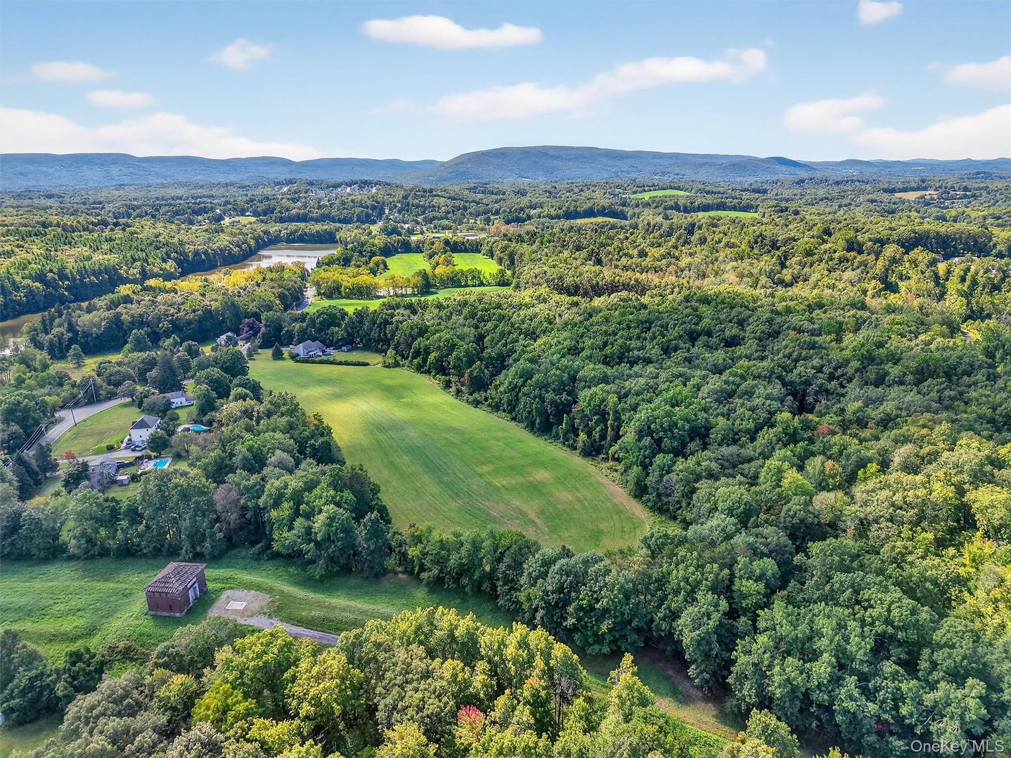 Mt Airy Road New Windsor, NY 12553 - Photo 18 of 23 a view of a lush green forest with trees and houses