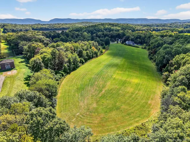 a view of a swimming pool with a lake view