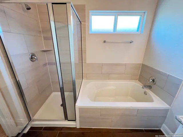a white bath tub sitting in a bathroom
