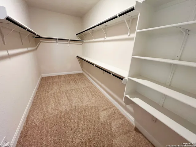 a view of an empty walk in closet