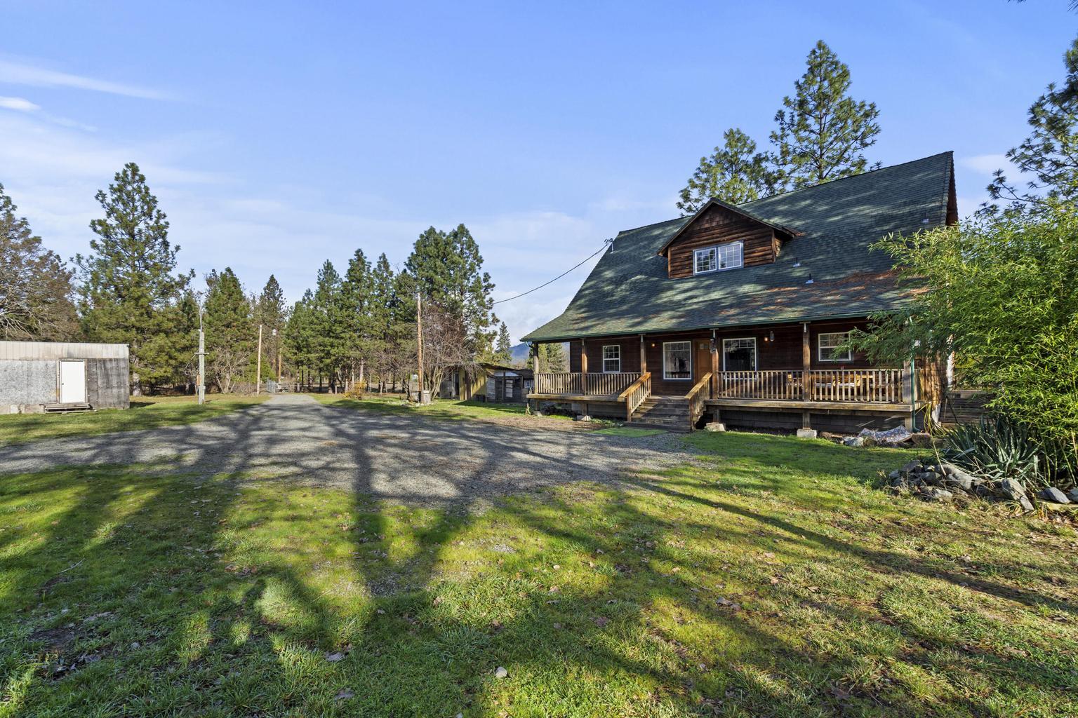 1190 Cedar Flat Road Williams, OR 97544 - Photo 30 of 45 a front view of a house with a garden