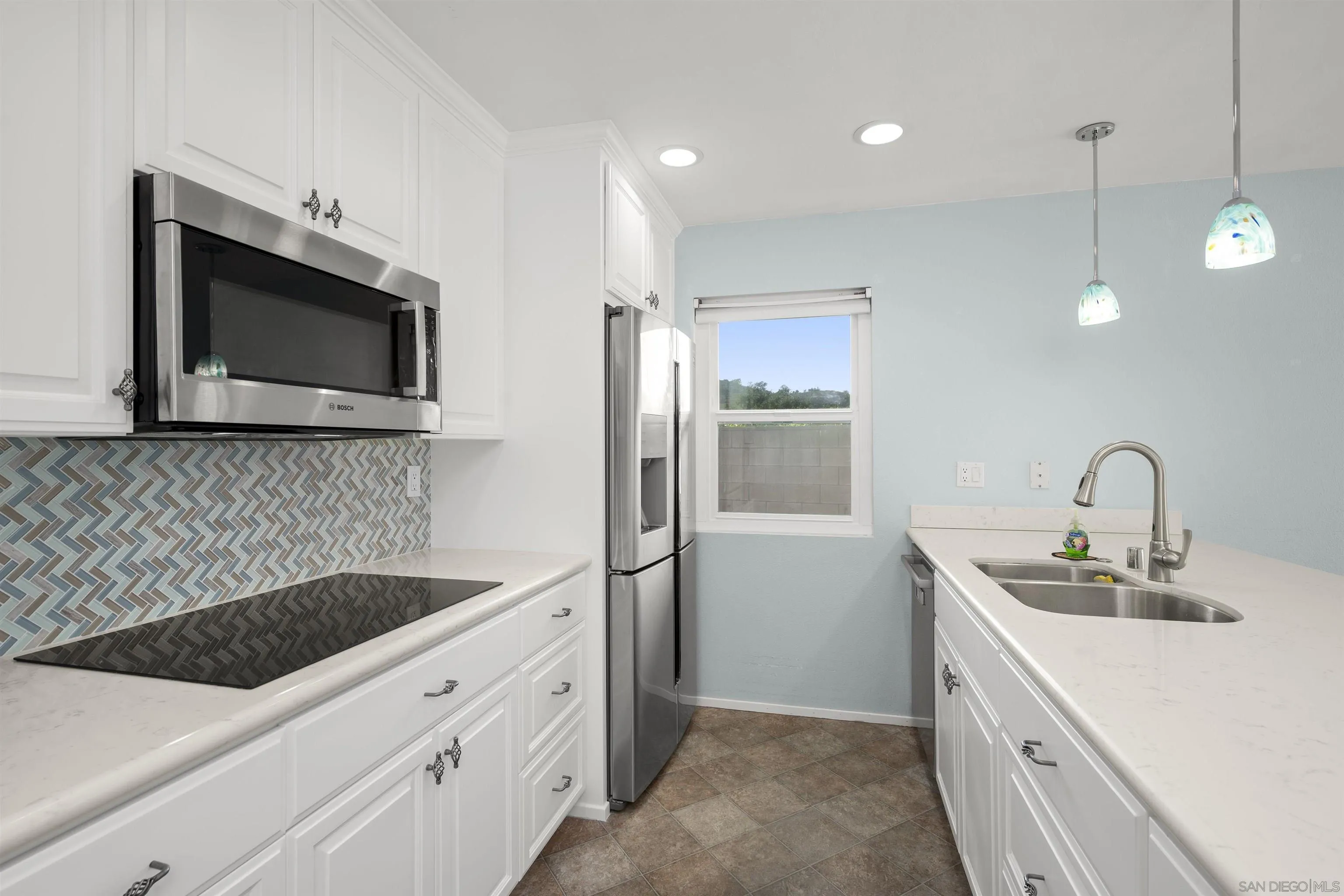 12679 Ridgeton Drive Lakeside, CA 92040 - Photo 11 of 33 a kitchen with a sink and stainless steel appliances