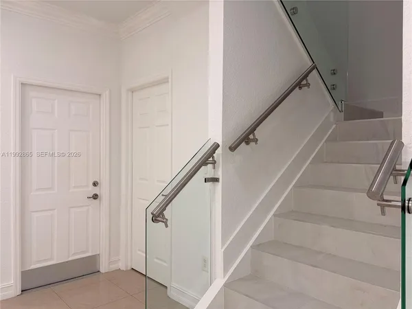 a view of staircase with white walls and white walls