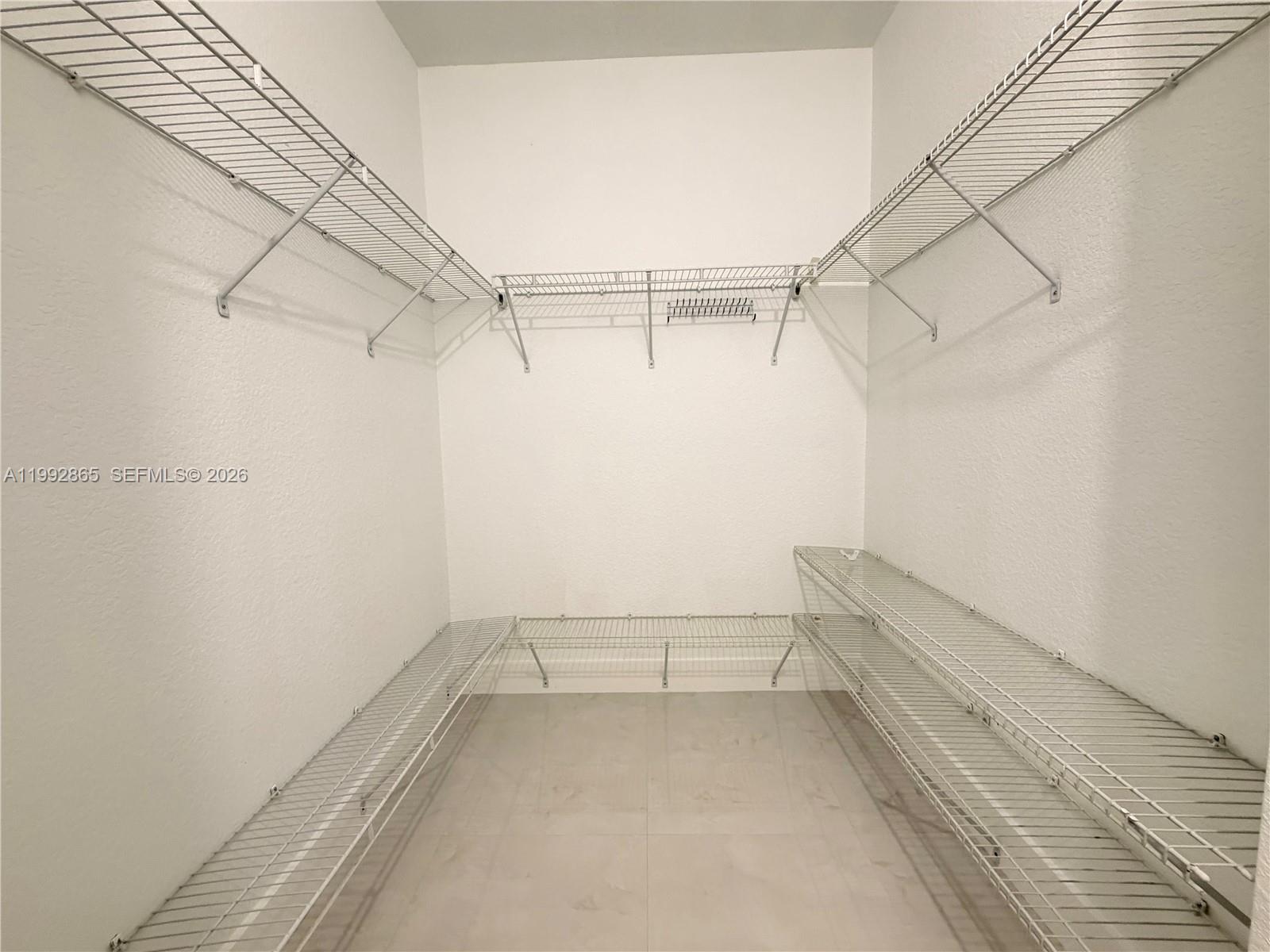 14738 Southwest 22nd Terrace Miami, FL 33185 - Photo 15 of 46 a view of a room with racks on the wall