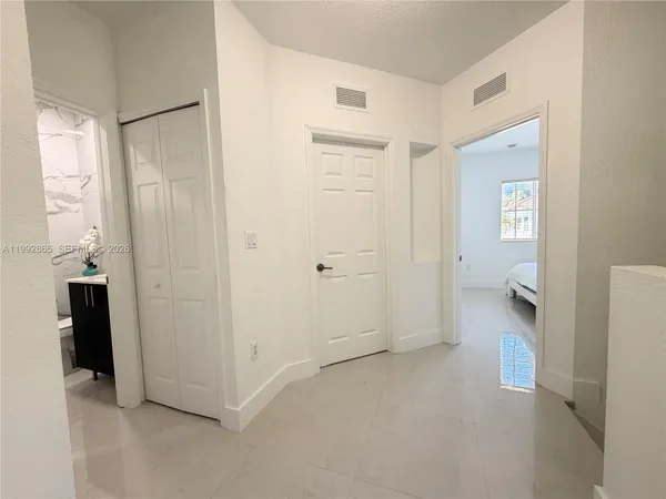 a view of a bathroom with a toilet