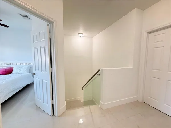 a view of a livingroom with wooden floor and closet
