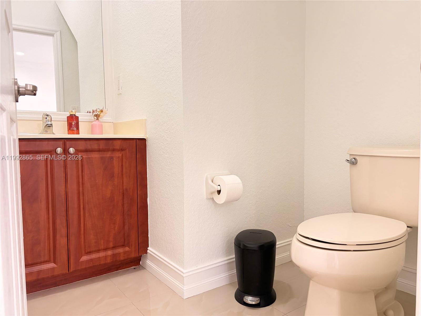 14738 Southwest 22nd Terrace Miami, FL 33185 - Photo 29 of 46 a bathroom with a toilet and a sink