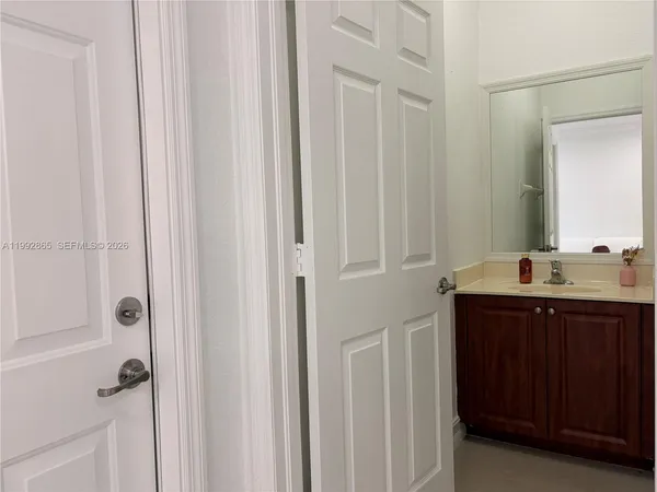 a bathroom with a sink and mirror