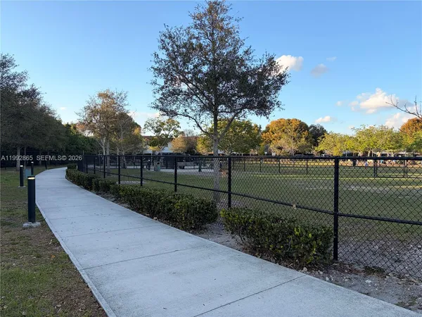 a view of a park with trees