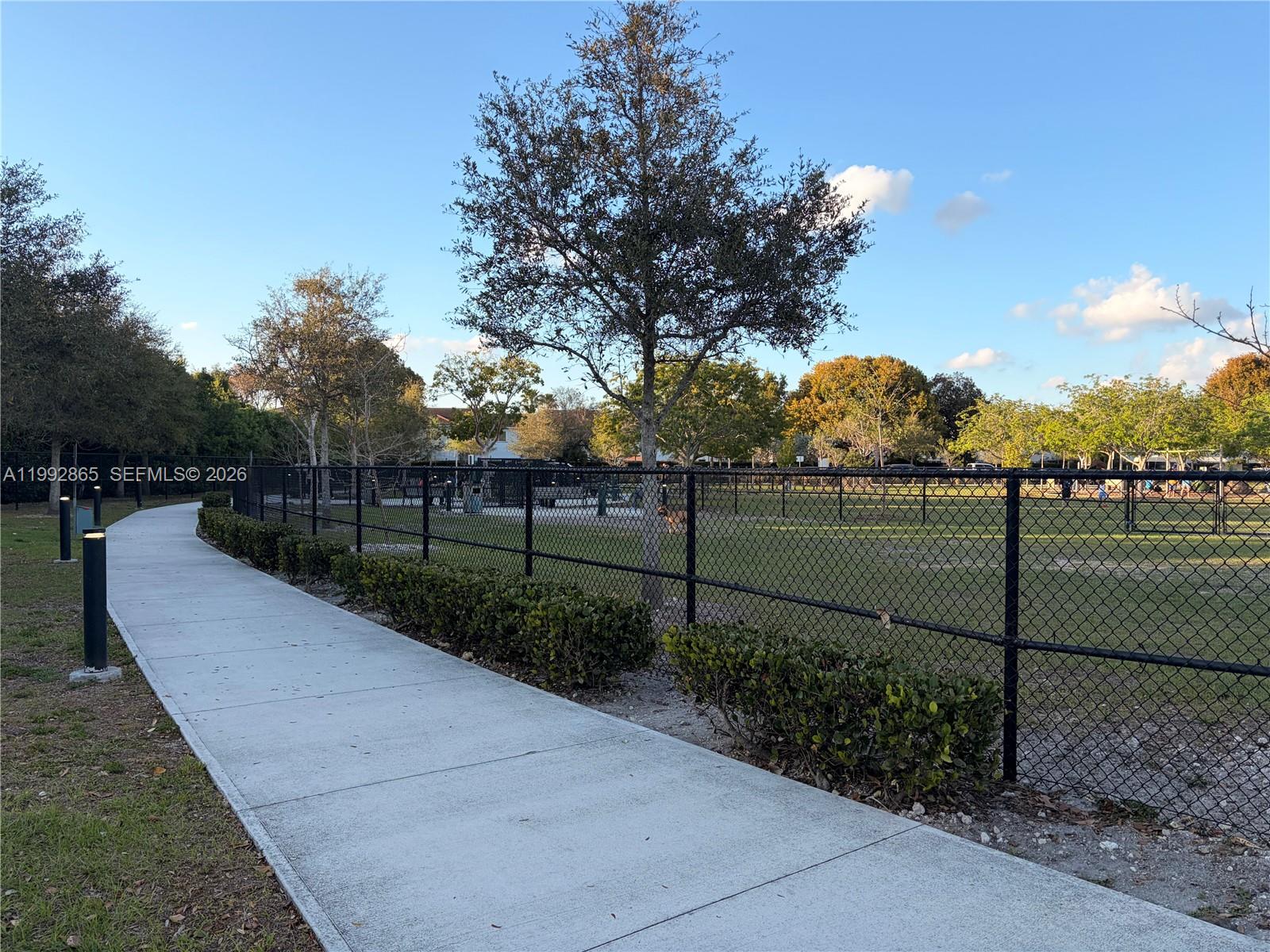 14738 Southwest 22nd Terrace Miami, FL 33185 - Photo 36 of 46 a view of a pathway with a wrought fence