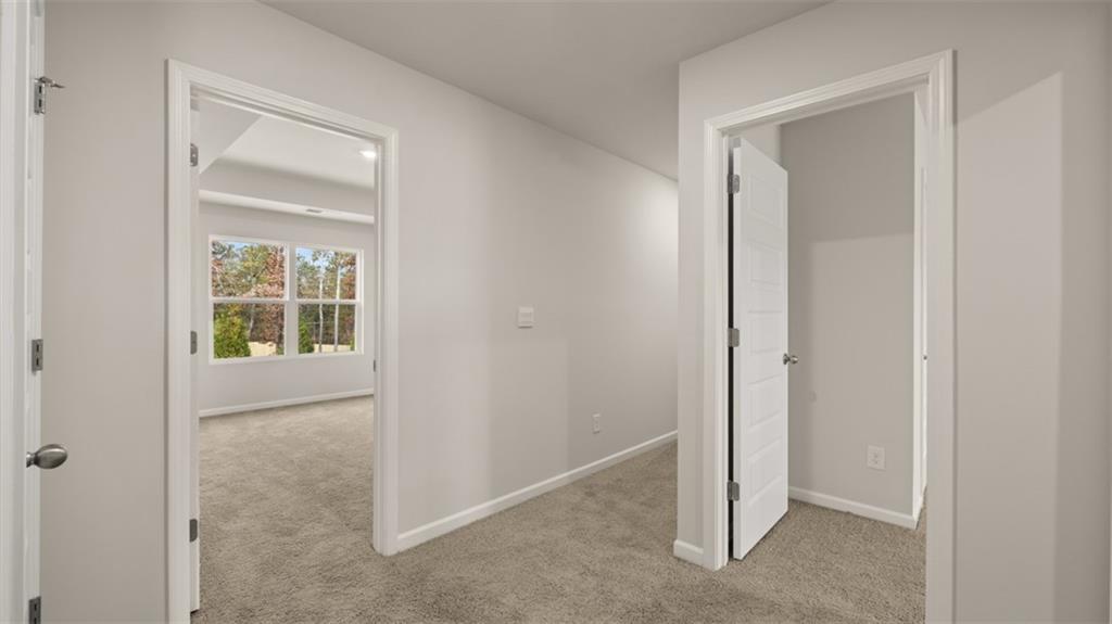 112 Holland Cove Winder, GA 30680 - Photo 20 of 26 a view of an empty room with a window