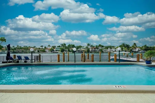 a view of a lake with outdoor seating