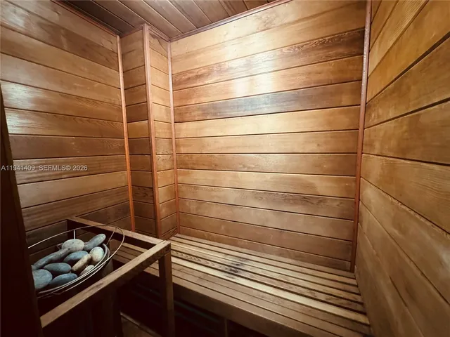 a bathroom with a double vanity sink mirror and toilet