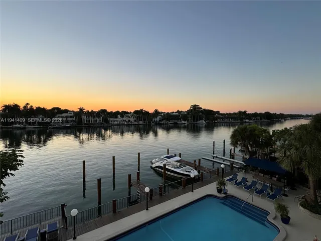 a bathroom with a double vanity sink mirror and toilet