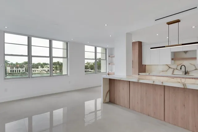a bathroom with a double vanity sink and a large mirror