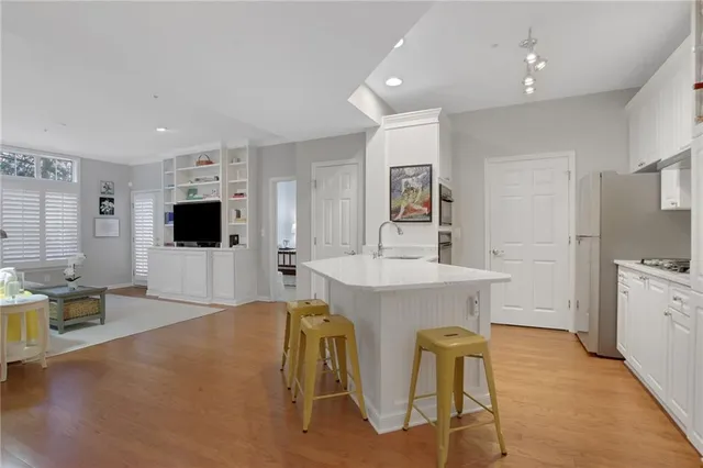 a spacious bathroom with a sink a mirror and a bathtub