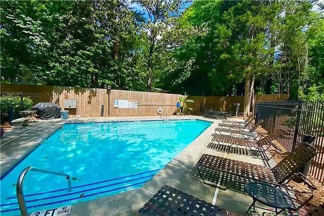 a view of a backyard with sitting area