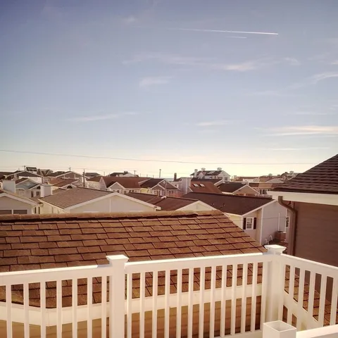 a view of a large building with a mountain