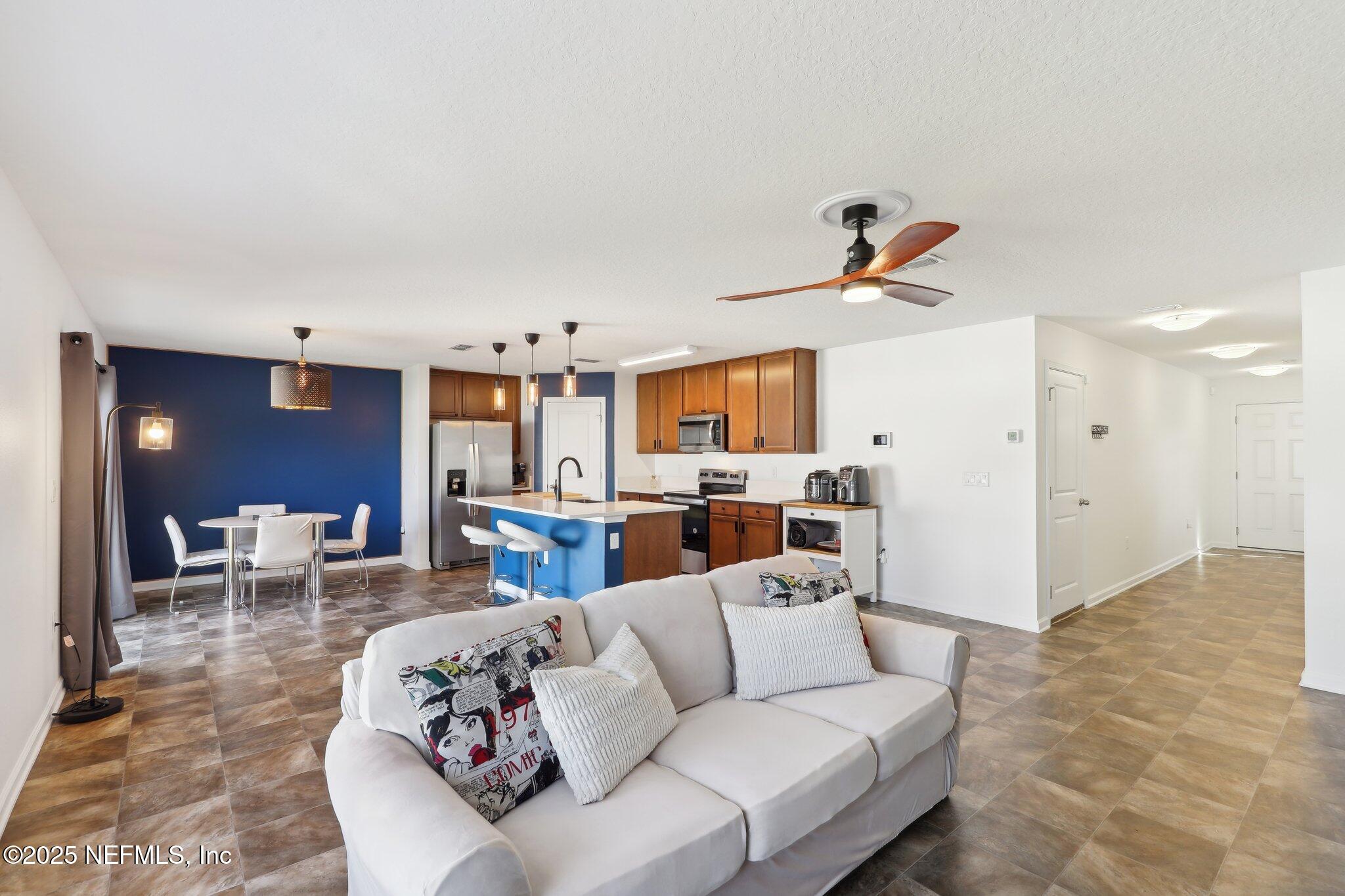 11461 Nathaniel Gorham Way Jacksonville, FL 32221 - Photo 13 of 42 a living room with furniture and kitchen view