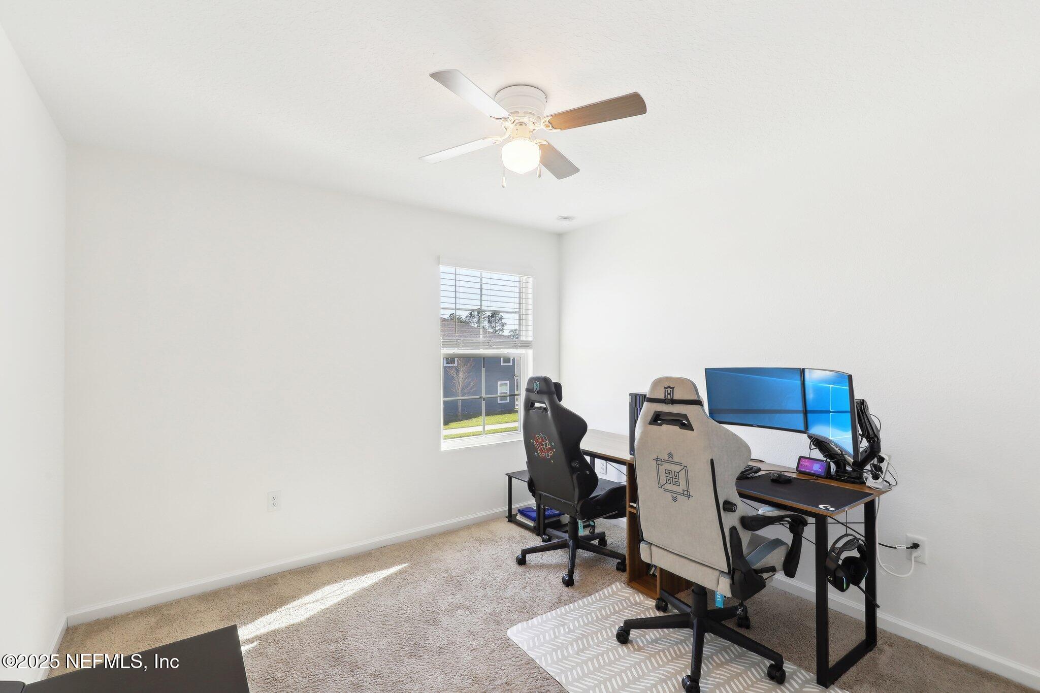 11461 Nathaniel Gorham Way Jacksonville, FL 32221 - Photo 19 of 42 a workspace with furniture and a window