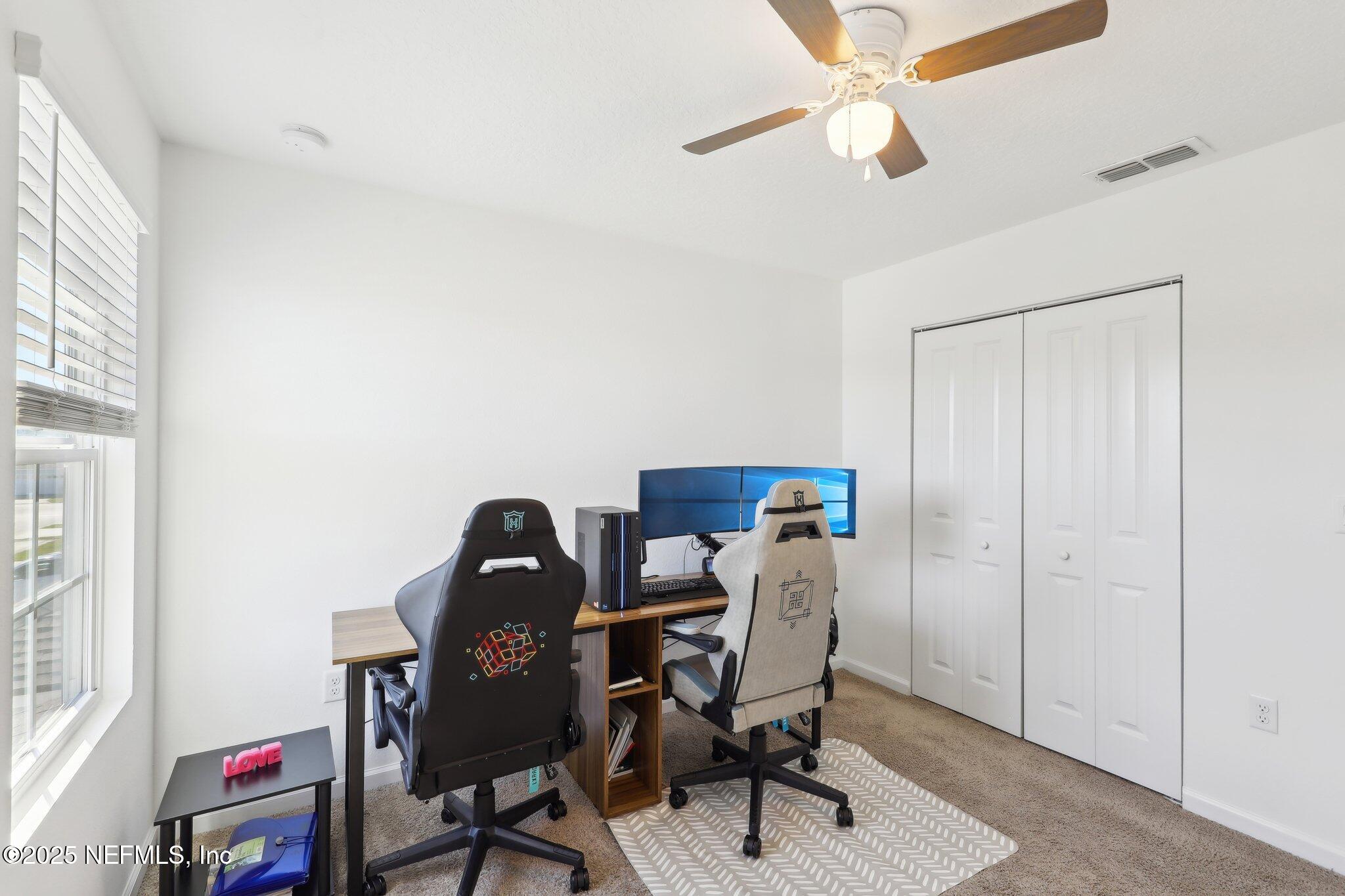 11461 Nathaniel Gorham Way Jacksonville, FL 32221 - Photo 20 of 42 a view of a workspace with furniture and a window