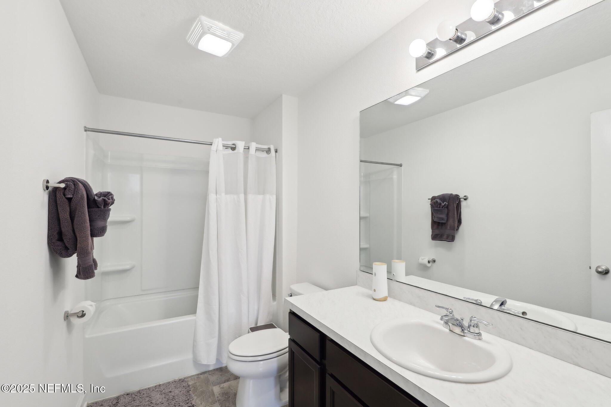 11461 Nathaniel Gorham Way Jacksonville, FL 32221 - Photo 24 of 42 a bathroom with a sink a toilet and shower