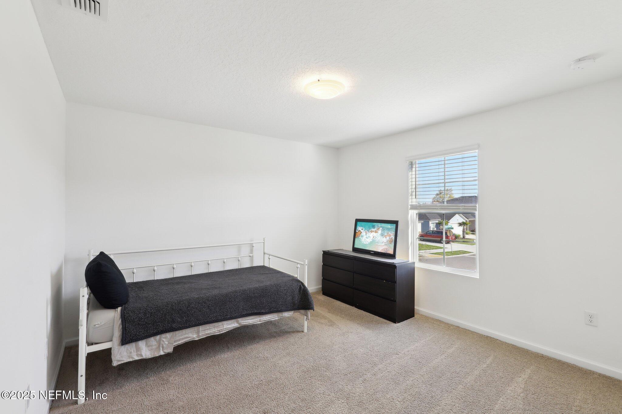 11461 Nathaniel Gorham Way Jacksonville, FL 32221 - Photo 25 of 42 a living room with furniture and a window