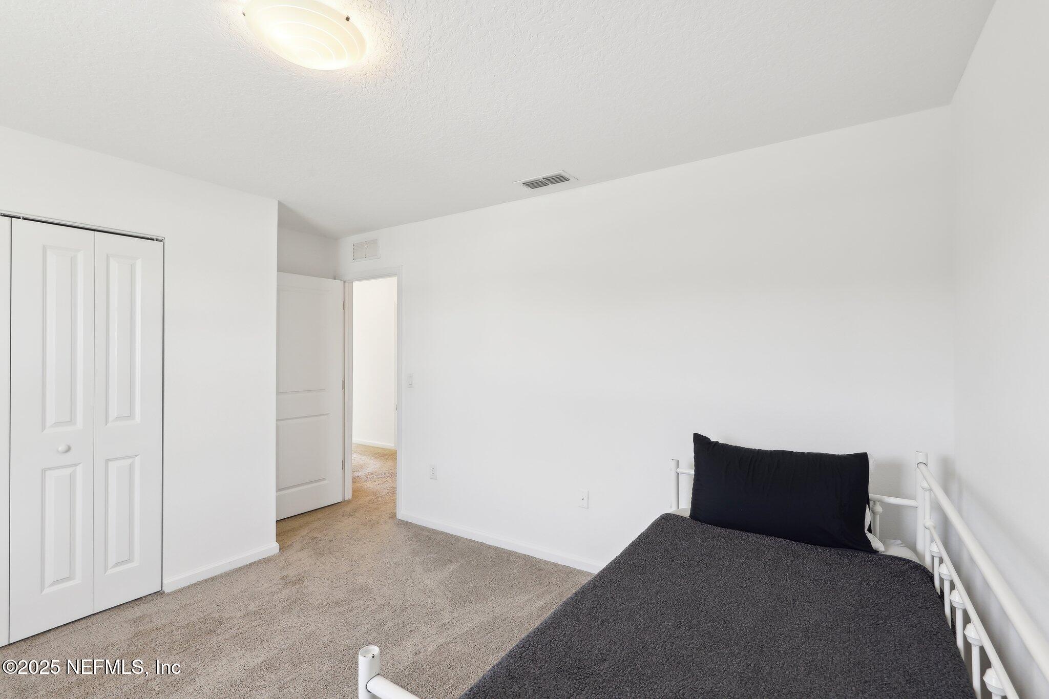11461 Nathaniel Gorham Way Jacksonville, FL 32221 - Photo 26 of 42 a living room with furniture and a ceiling fan