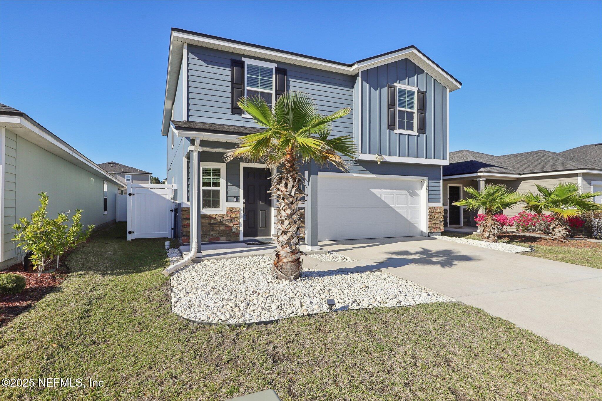 11461 Nathaniel Gorham Way Jacksonville, FL 32221 - Photo 6 of 42 a front view of a house with garden