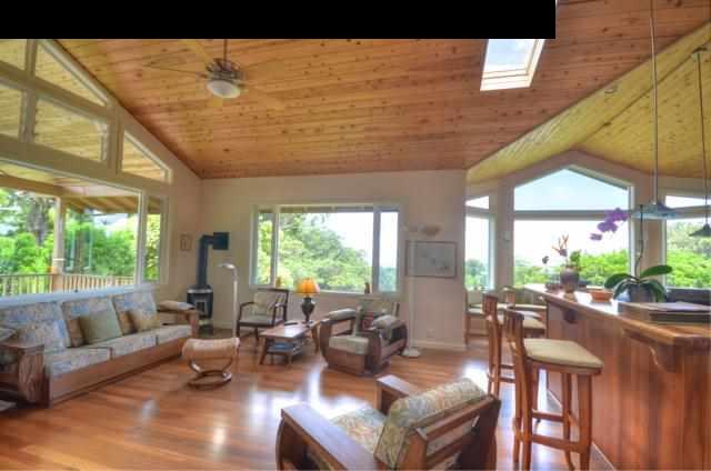 1629 West Kuiaha Road Haiku, HI 96708 - Photo 9 of 29 a living room with furniture and a large window
