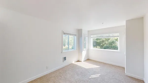 an empty room with windows