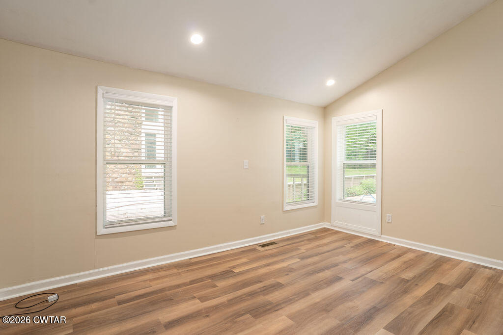 7 Timberlake Drive Jackson, TN 38305 - Photo 19 of 38 a view of empty room with wooden floor and fan