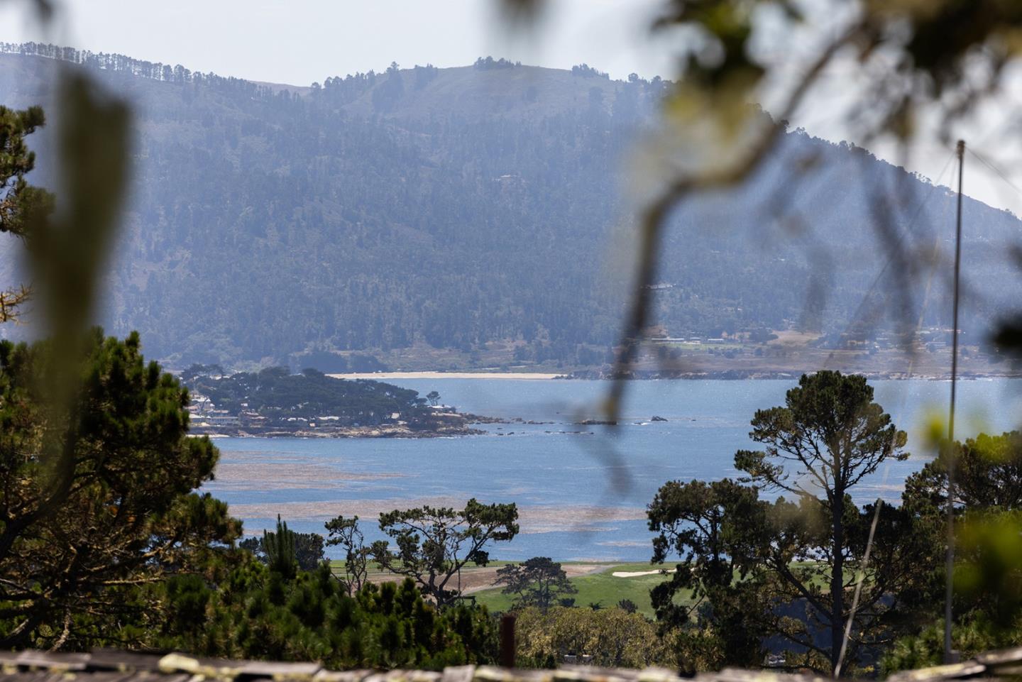 1488 Bonifacio Road Pebble Beach, CA 93953 - Photo 5 of 10 a view of a lake with a mountain in the background