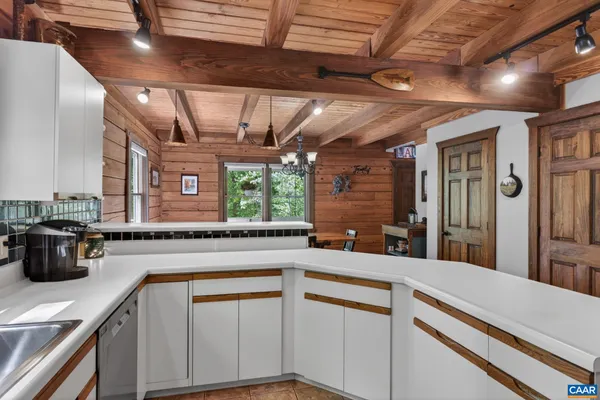 a kitchen with stainless steel appliances granite countertop a stove cabinets and a refrigerator