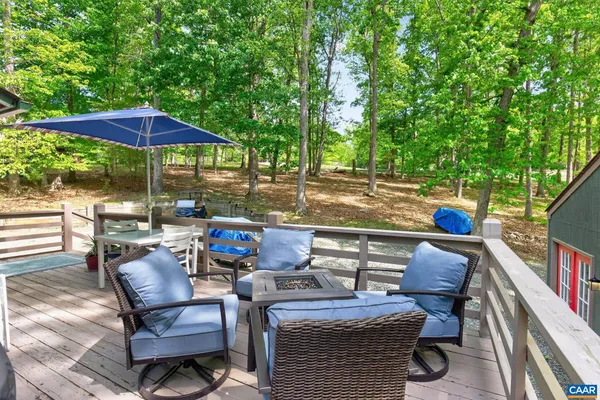 a view of a patio with table and chairs and potted plants