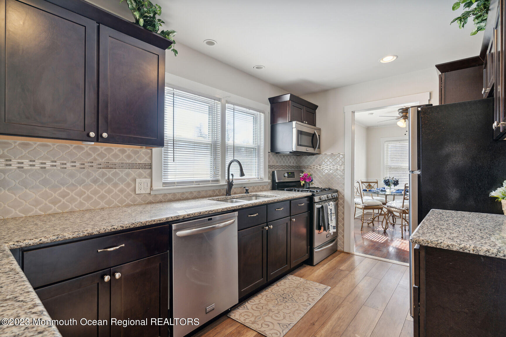 414 Drum Point Road Brick, NJ 08723 - Photo 8 of 16 a kitchen with a sink stove and refrigerator