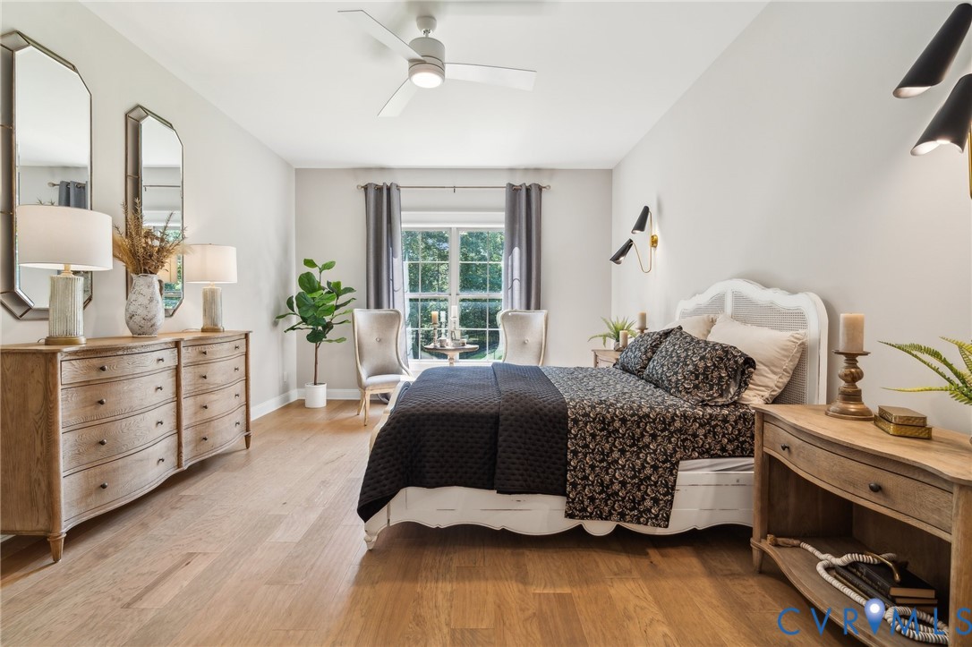 7751 Dandridge Drive Quinton, VA 23141 - Photo 11 of 19 a bedroom with a bed and wooden floor