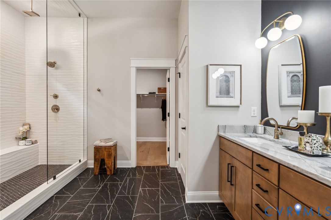 7751 Dandridge Drive Quinton, VA 23141 - Photo 4 of 19 a bathroom with a double vanity sink mirror and shower