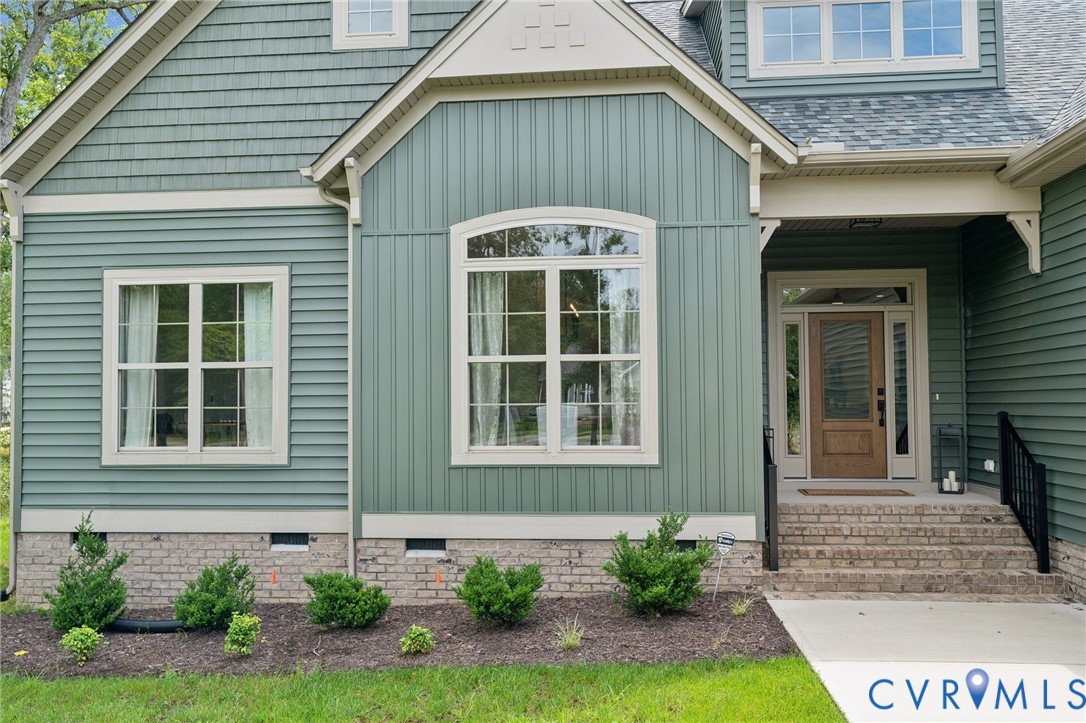 7751 Dandridge Drive Quinton, VA 23141 - Photo 5 of 19 a front view of a house with garden