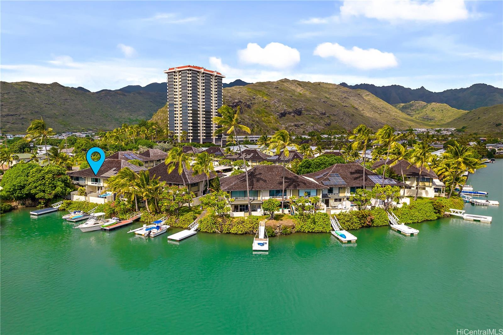a view of residential houses with outdoor space and a lake view